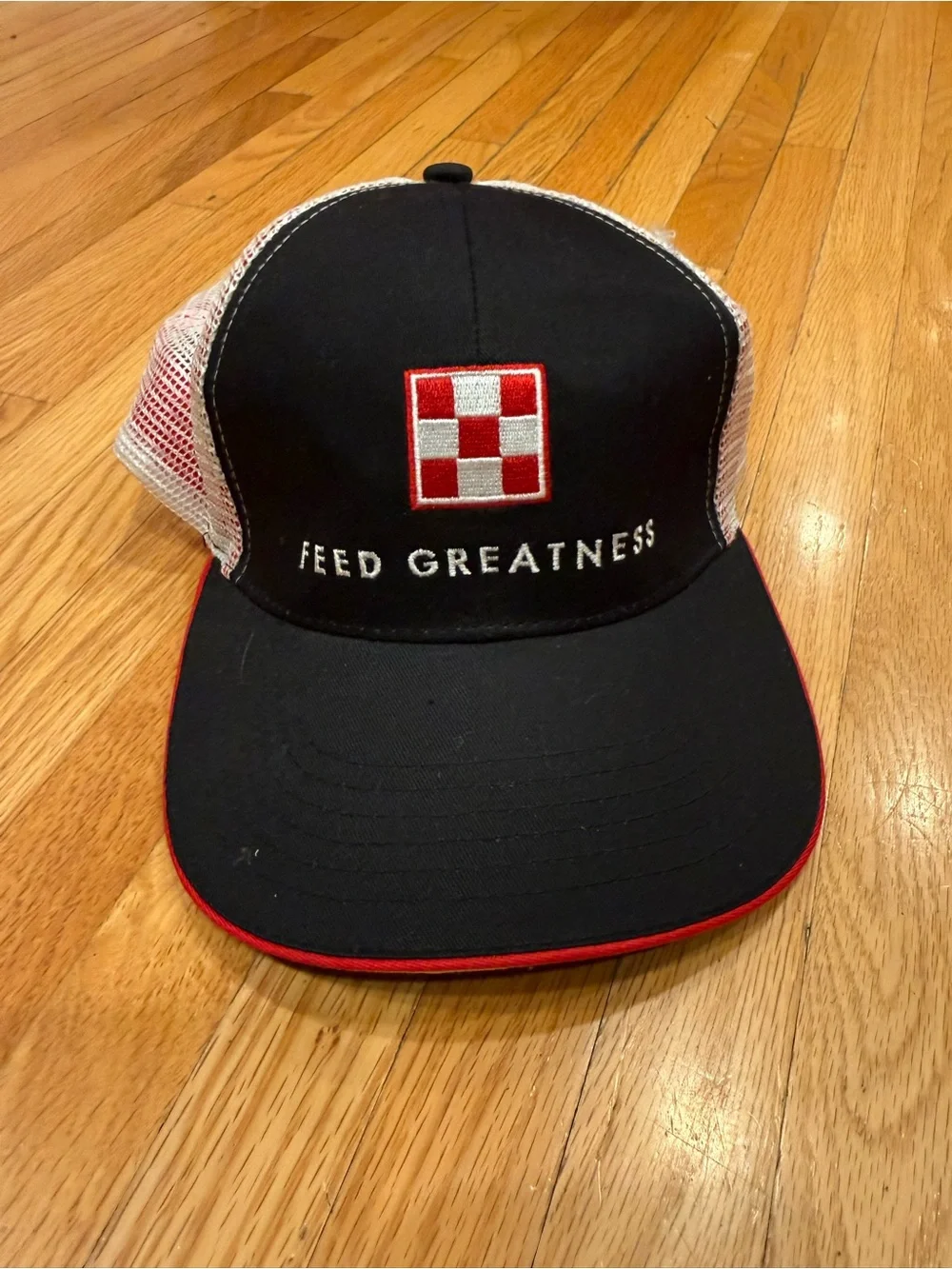 Feed Greatness Black & White Trucker Cap